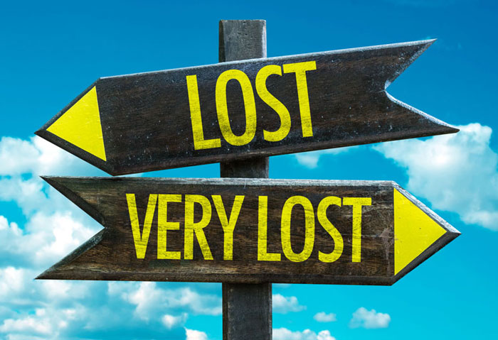 Sign showing an arrow facing left with the word lost and an arrow facing right with the words very lost