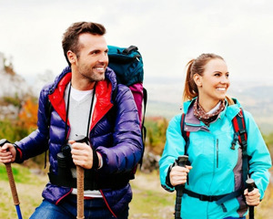 young couple hiking & smiling I crowns & bridges burien WA