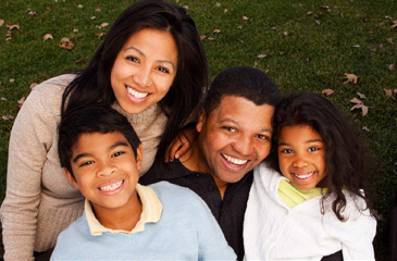 Large family sitting outside l Dentist 98166